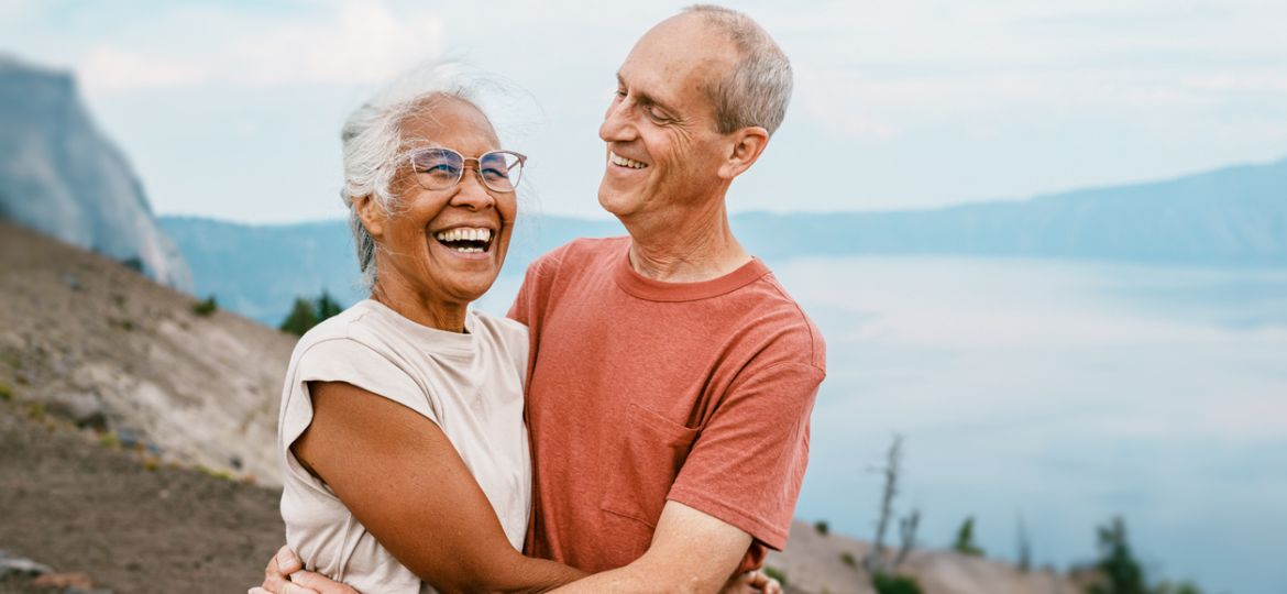 Joyful retired couple hiking