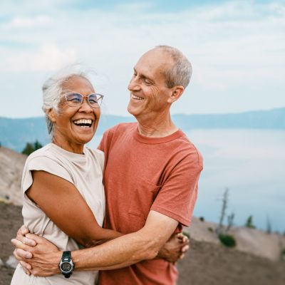 Joyful retired couple hiking